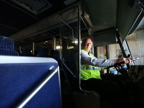 Bob Clouatre, one of the longest serving drivers within the Saskatchewan Transportation Company (STC), with more than 38 years of service under his belt, sits in one of the buses at the STC garage in Saskatoon on May 29, 2017.