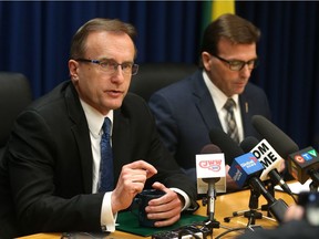 Health Minister Jim Reiter (left) holds a press conference at the Saskatchewan Cabinet office on May 8, 2017 in Saskatoon to answer questions about the new Saskatchewan Health Authority.