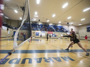 Dana Wood, a Grade 11 student from Marion Graham Collegiate, returns the birdie during the City high school badminton championship at Walter Murray Collegiate in Saskatoon, April 27, 2017.