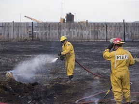 Members of the Saskatoon Fire Department, alongside crews from the Delisle Fire Department and the Vanscoy Fire Department responded to a large grass fire outside the city off highway 11 on Saturday, May 6, 2017.