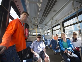 Cory Shrigley, left, who works for Saskatoon Transit discusses route 15 during the Jane's Walk tour in Saskatoon on Saturday, May 6, 2017.