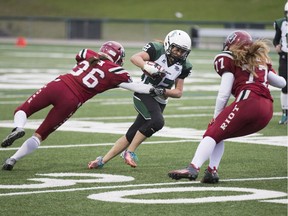 Saskatoon's Samantha Matheson takes on Adrienne Zuck (left) and Chantal Vogel during Saturday action at SMF Field.