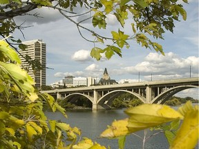 Fall colours on the South Saskatchewan riverbank with the Delta Bessborough hotel in the background.