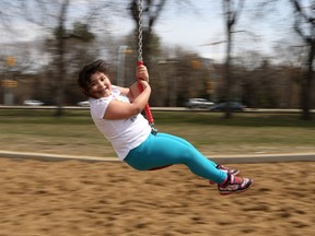 5-year-old Jastine Perdomo, who spent every day at Kinsmen Park last season, was all smiles on the zip line at PotashCorp Playland in Saskatoon on May 2, 2017. She can't wait for May 28, when the park opens, so she can ride the ferris wheel and help her grandparents run the concession. (Michelle Berg / Saskatoon StarPhoenix)