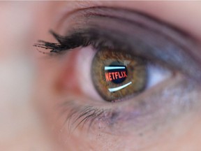 In this photo illustration the Netflix logo is reflected in the eye of a woman on September 19, 2014 in Paris, France.