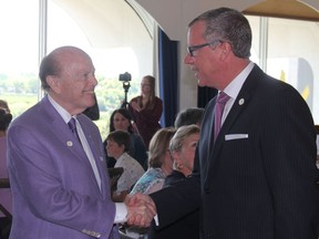 Vancouver-based businessman and philanthropist Jim Pattison, shakes hands with Saskatchewan Premier Brad Wall at a funding annoucement for the province's children's hospital on May 30, 2017. The Pattison Foundation contributed a gift of $50 million to the hospital and as a result, the hospital and the foundation that serves it will now be renamed after Pattison, who is originally from Luseland Sask. (Morgan Modjeski/The Saskatoon StarPhoenix)