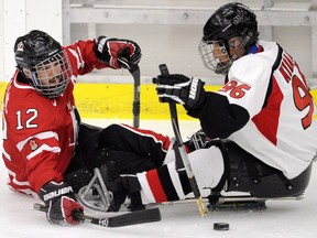 Greg Westlake (left) has extensive experience on the international sledge hockey stage.
