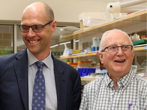 Dr. Michael Kelly, left, meets with his patient Don Bickerdike at the Health Sciences building in Saskatoon on June 13, 2017.