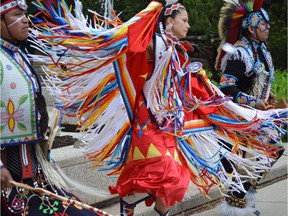 A group of indigenous dancers perform at a ceremony on Wednesday, June 14, 2017 for the raising of the Reconciliation Flag at Saskatoon's City Hall. The ceremony honoured survivors of residential schools.