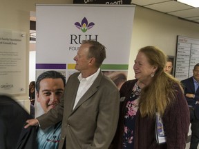 Paul Babyn, and Arla Gustafson revile a plaque during a media event to announce a new O-arm, a piece of machinery that was purchased thanks to the $1 million donation from the Joe Remai Family Foundation, at Royal University Hospital in Saskatoon, SK on Thursday, June 15, 2017.