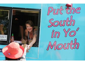 SASKATOON, SK - June 18, 2017 - Roxi Degoesbriand serves up a rebel melt at the Food Truck Wars event at the Sutherland Curling Club in Saskatoon on June 18, 2017. (Michelle Berg / Saskatoon StarPhoenix)
Michelle Berg