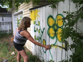 Sherry Wiebe, who is being intimidated by members of a house behind hers, has come up with her own "Old Lady Gang" where she covers up graffiti with her own paintings in Saskatoon on June 19, 2017.