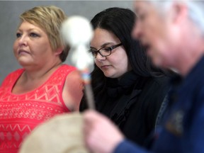 SASKATOON, SK - June 19, 2017 - : FSIN Chief Heather Bear, left, and Director of Human Rights Watch Canada Farida Deif listen to Elder Marjorie Beaucage's prayer before a press conference about the "fractured relationship between law enforcement and indigenous communities" found by the Human Rights Watch study at Station 20 West in Saskatoon on June 19, 2017. (Michelle Berg / Saskatoon StarPhoenix)
Michelle Berg, Saskatoon StarPhoenix