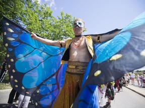 Eric Shearer, who has been to 14 years of Pride Parade stands in line to march downtown in celebration of the Saskatoon Pride Parade in Saskatoon, June 24, 2017.