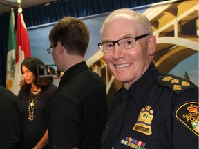 Chief Clive Weighill of the Saskatoon Police Service, poses for a photo at Saskatoon's City Hall, as chair of the board of police comissioners Darlene Brander, speaks with reporters about Weighill's retirement.