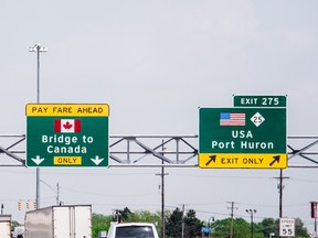 US - Canada border highway direction sign