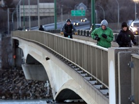 Commuters jog, bike and walk across the Senator Sid Buckwold Bridge Tuesday morning in Saskatoon on December 20, 2016.