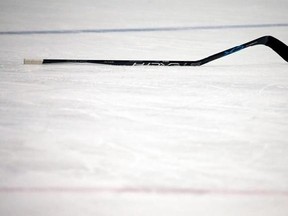 FILE - In this Feb. 4, 2017, file photo, a broken stick rests on the ice during the third period of an NHL hockey game between the Boston Bruins and the Toronto Maple Leafs in Boston. Despite technological advances that turn carbon fiber into one-piece, fine-tuned machines that are custom made for each NHL player to become extensions of their hands, hockey sticks can still break. And, sometimes it happens at the worst times. (AP Photo/Mary Schwalm, File)