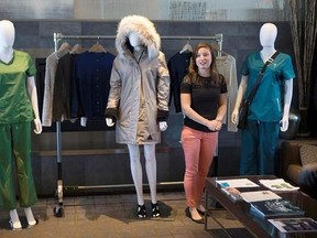 Justine Decaenes, Project Leader at CTT Group stands next to a heated coat, as she presents at a Smart Apparel Event in Toronto on Wednesday June 14, 2017. THE CANADIAN PRESS/Chris Young