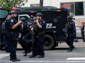 NYPD officers speak outside the Bronx-Lebanon Hospital as they respond to an active shooter north of Manhattan in New York on June 30, 2017. A gunman who opened fire inside a hospital in the Bronx borough of New York, injuring several people, is dead, a police spokesman told AFP.Several New York media outlets reported that at least two people were injured, while the New York Times said three doctors were hurt. The hospital, a 1,000-bed facility in a busy sector of the city's north, was encircled by police following the incident.