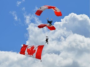 Captain John Hart, Sergeant Josh Oakie and Corporal Tyler Goshawk of the SkyHawks parachute demonstration team show off the "Canadian T" formation at the air show at Camp Dundurn on Saturday, June 10, 2017. (Matthew Olson / Saskatoon StarPhoenix)