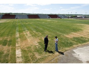 Gerry Krochak, director of marketing for Country Thunder Saskatchewan talks to Ted Gross, vice president operations, on the new sod in the concert bowl area in Craven.