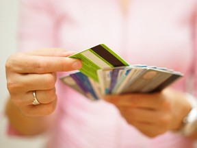 woman choose one credit card from many, concept of  credit card debt,