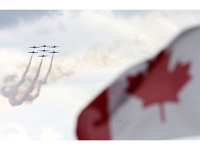 The 431 Air Demonstration Team (Snowbirds) fly at the "Canada Remembers Armed Forces Day -- Salute to Heroes" air show at 17 Wing Detachment Dundurn on June 11, 2017.