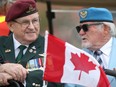 Veterans Jim McKinny and Malcolm McPherson take part in the "parade of heroes" ceremony at the Canada Remembers Armed Forces Day "Salute to Heroes" air show at 17 Wing Detachment Dundurn on June 11, 2017.