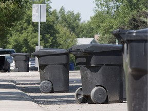 Garbage bin pickup in the Tobin Crescent area Thursday, July 11, 2013