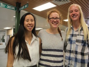 Holy Cross High School Students An Smith, left, Maria Gursky and Emma Linsley stand in school's main entrance on May 25, 2017. The three students played an integral roll in organizing a wellness conference that was recently held at Holy Cross where students can speak openly and honestly about issues affecting student wellness. (Morgan Modjeski/The Saskatoon StarPhoenix)