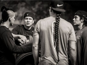 Lacrosse-playing brothers Lyle Thompson (left), Jerome (middle, facing) and Miles (right) are playing against sibling Jeremy (not pictured) for a National Lacrosse League championship.