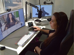 Natalia Mogollon, better known by her screen name Alinity, sits down in front of her computer before her live stream on Tuesday, May 30, 2017. (Matthew Olson / Saskatoon StarPhoenix)