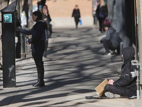 Panhandlers frequent 21st Street between 1st and 2nd Avenues on March 18, 2015 in Saskatoon.