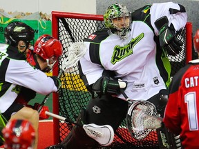 The Calgary Roughnecks' Curtis Dickson scores on Saskatchewan Rush goalie Aaron Bold during National Lacrosse League action in Calgary on Saturday April 29, 2017. Gavin Young/Postmedia Network ORG XMIT: POS1704292205429720