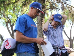 Saskatoon Fire Chief Morgan Hackl, left, and Stephanie Massicotte of CTV Saskatoon, sort out a game plan as they prepare to start their 36-hour challenge on the streets of Saskatoon in support of Sanctum Care Group. 10 people from across the city are taking part in this year's challenge, with the proceeds going towards the Sanctum Care Group, which supports people in Saskatchewan affected by HIV and AIDs.