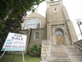 A for sale sign is seen in front of the Third Avenue United Church in Saskatoon, SK on Friday, June 9, 2017.