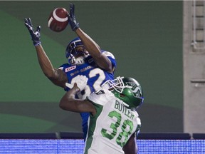 Winnipeg Blue Bombers receiver Justice Liggins, 82, catches a go-ahead touchdown pass over Saskatchewan Roughriders defensive back Crezdon Butler on Saturday at Mosaic Stadium.