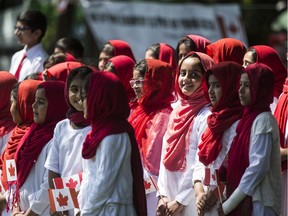 A group of singers perform the National Anthem during he Ahmadiyya Muslim Jama event to pledge allegiance to Canada at Dr. Gerhard Helberg Park in Saskatoon, July 1, 2017.