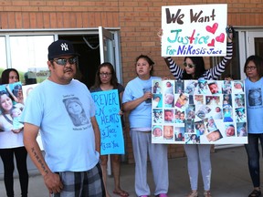 Jeff Longman and his family stand outside Saskatoon provincial court after the sentencing dates were set for the teen who killed baby Nikosis Jace Centre a year ago.