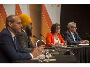 L-R: Guy Caron, Jagmeet Singh, Niki Ashton, and Charlie Angus listen to a question during the federal NDP fifth leadership debate at TCU Place in Saskatoon on July 11, 2017.