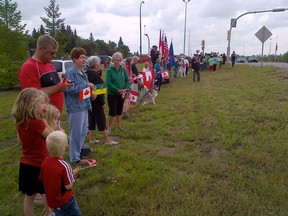 Supporters line the side of the road to support the Wounded Warriors Weekend cavalcade.