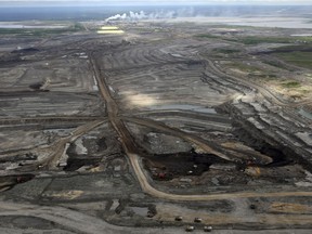 Ariel photo of the Syncrude plant, mine pit and tailings ponds and green reclamation areas at Ft.McMurray, Alberta, June 8, 2010.