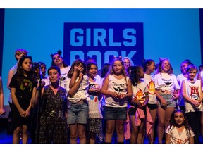 Campers sing together at the showcase for the Girls Rock camp at the Broadway theatre in Saskatoon, Saskatchewan on July 15, 2017. (Brandon Harder/Saskatoon StarPhoenix)