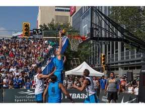 Michael Lieffers of team Saskatoon reaches for a slam dunk during the final game of the 3X3 basketball Saskatoon Masters tournament in Saskatoon, Saskatchewan on July 16, 2017.