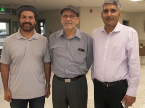 From Left, Shamoon Rashid, president of the Ahmadiyya Muslim Jama'at ; Tanveer Shah,  regional president of the Prairie Region, and Muhammad Shahid facilitated a tour of the new Ahmadiyya mosque for visitors  at an event organized by the Canadian Roots Exchange. Photo by Darlene Polachic