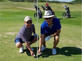 Gerry Hanke (left) and Bruce Baier pose with their golf balls on the eighth hole of the Heather course at Moonlake Golf and Country Club. Hanke and Baier hit back to back holes-in-one on the hole on Friday, July 7, 2017. (Supplied photo/Tammie Baier and Nicholas Kasper)