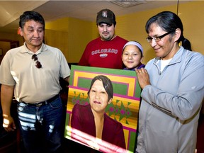 Pauline and Herb Muskego were given a painting of their daughter Daleen Bosse Muskego who was killed, July 11, 2011. Jeremiah (in red) was Daleen's husband and Faith Muskego, her daughter. The painting was a gift from the Saskatoon Police Department present by Chief Clive Weighill at a lunch at Johnny Boy Restaurant. . (Gord Waldner/Star Phoenix)
Gord Waldner, Saskatoon Star Phoenix