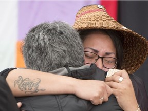 Starr Drynock receives a hug after speaking about her mother Deborah Evangeline Edwards at the National Inquiry into Missing and Murdered Indigenous Women and Girls taking place in Whitehorse on Wednesday, May 31, 2017. THE CANADIAN PRESS/Jonathan Hayward
