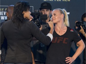 Amanda Nunes, left, and Valentina Shevchenko, pose during media day for Saturday's UFC 213, in Las Vegas on Thursday, July 6, 2017. (Erik Verduzco/Las Vegas Review-Journal via AP)